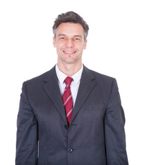 Smiling Businessman Against White Background