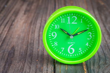 Clock on wood background