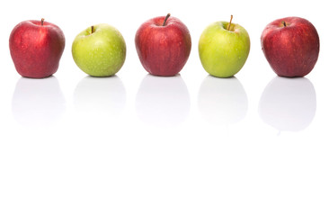 Red and green apple over white background