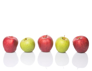 Red and green apple over white background