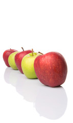 Red and green apple over white background