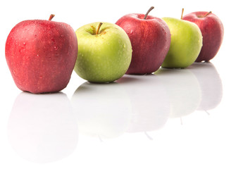 Red and green apple over white background