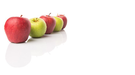 Red and green apple over white background
