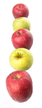 Red and green apple over white background