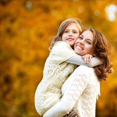 Young mother and her toddler girl have fun