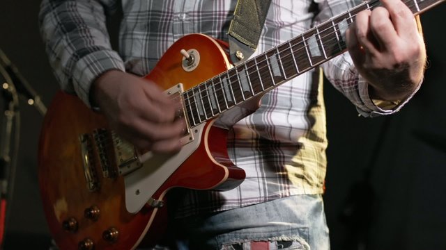 musician plays the electric guitar