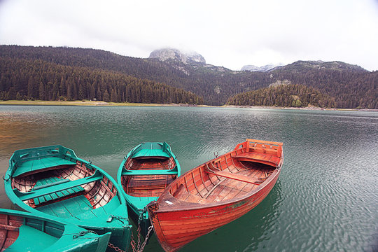 Fototapeta wooden boat on a mooring mountain lake
