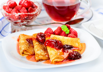 Pancakes with strawberry jam.