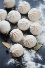 Close-up of raw georgian traditional khinkali, vertical shot