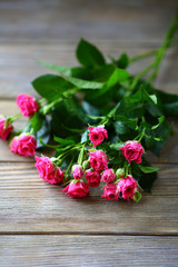 red rose on wooden background