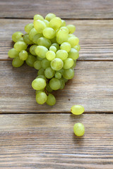 bunch green grapes on boards