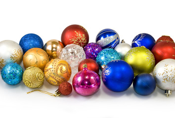 image of many Christmas tree decorations on a white background