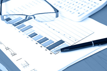 business chart report with black pen