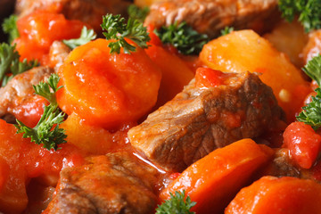 stew in tomato sauce and vegetables macro horizontal. Background
