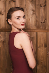 Fototapeta premium beautiful girl in a burgundy dress
