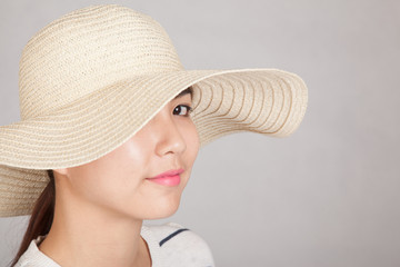 Beautiful Asian girl with sun hat