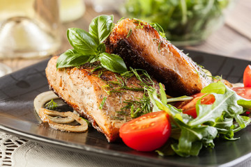 Fried salmon steak with vegetables