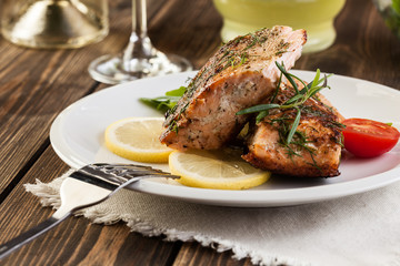 Fried salmon steak with vegetables
