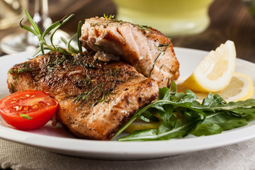 Fried salmon steak with vegetables