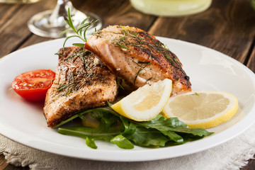 Fried salmon steak with vegetables