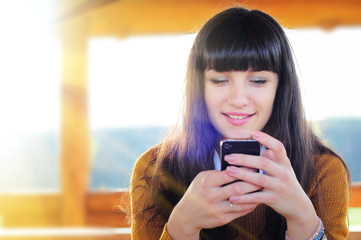 Beautiful casual woman texting