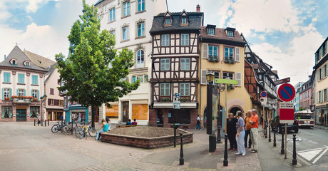 Fototapeta premium Panoramic view on old street with half timbered houses in Colmar