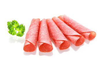 Thinly sliced rolled spicy salami sausage
