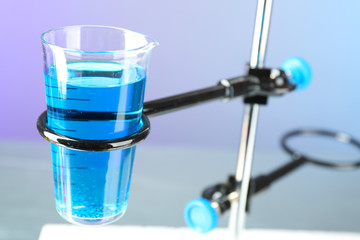 Fixed glass on support  on light blue background