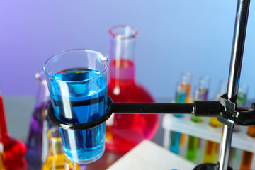 Different laboratory glassware with colorful liquid
