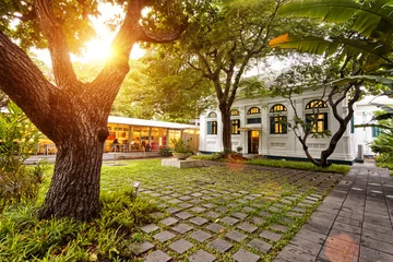 Garden poster Restaurant scene of restaurant front yard in sunset