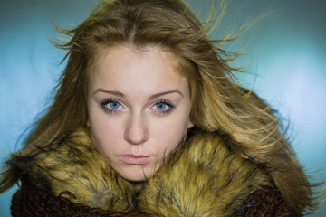 Portrait of the girl with a fur collar