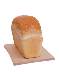 loaf of bread on cutting board isolated on white background