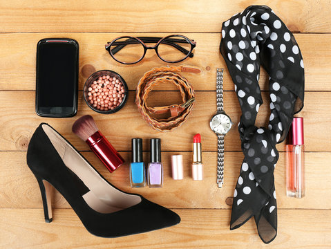 Essentials fashion woman objects on wooden background