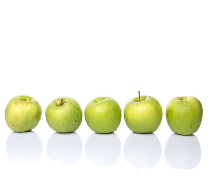 A group of green apples over white background
