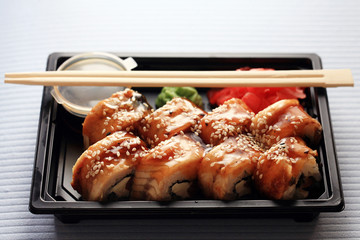 delivery service Japanese food rolls in plastic box