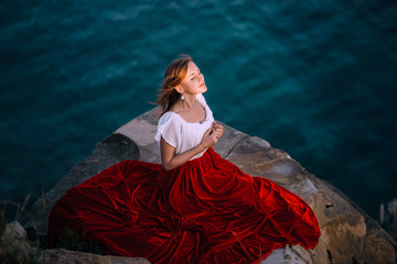 Beautiful girl dressed in white and red dress