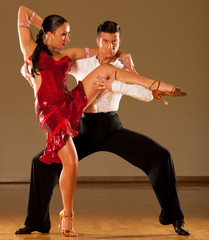latino dance couple in action - dancing wild samba