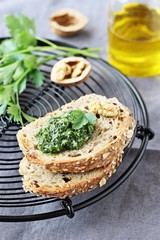 Delicious homemade pesto of green herbs with walnuts