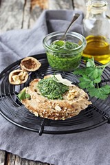 Delicious homemade pesto of green herbs with walnuts