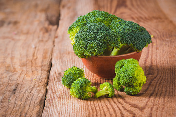 Green delicious broccoli on a wooden rustic table