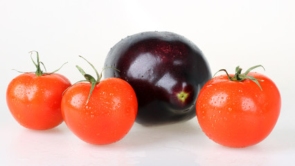 Fresh red tomatoes and aubergine