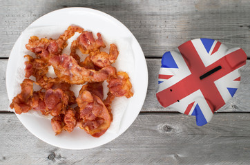 Bring home the bacon concept piggy bank overlaid with American f