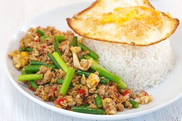 Asian food fried garlic plant and pork with egg
