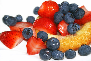 Sponge cake shell filled with fresh ripe berries