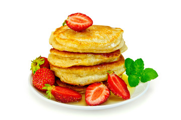 Flapjacks with strawberries and mint in plate