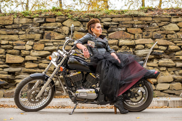 Fototapeta na wymiar girl on a motorcycle