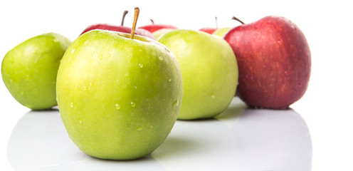 Red and green apple over white background
