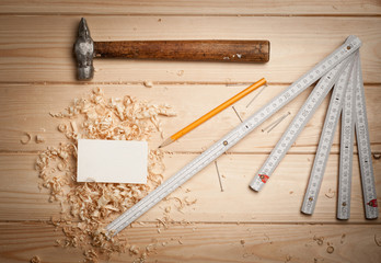 joinery tools on wood table background with business card