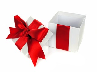 Opened white Christmas gift box with lid red bow and ribbon