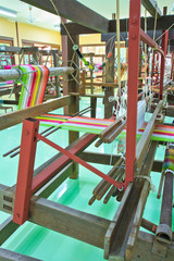 Fototapeta na wymiar Ancient style woven silk machine in Thailand